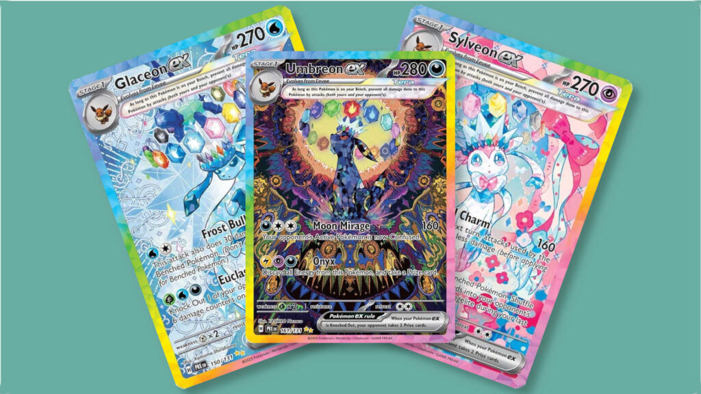 Three cards from Pokémon set Prismatic Evolutions fanned out: Glaceon, Umbreon and Sylveon